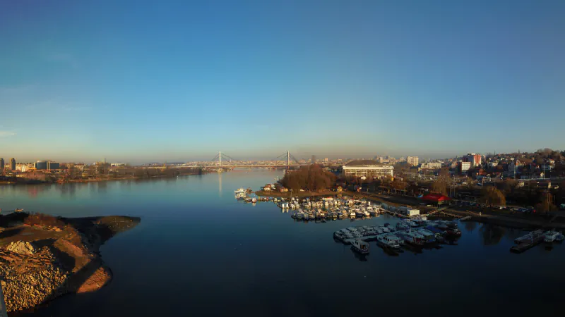 Belgrade’s riverfront and marina in a wide city panorama.