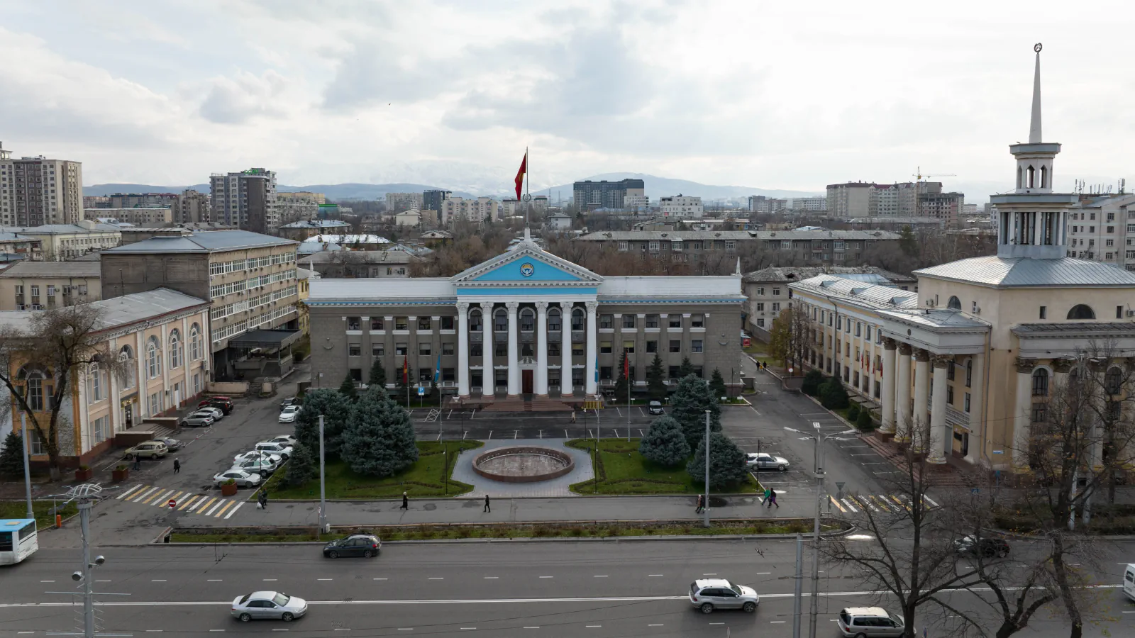Aerial view of a square, streets and mountains in Bishkek