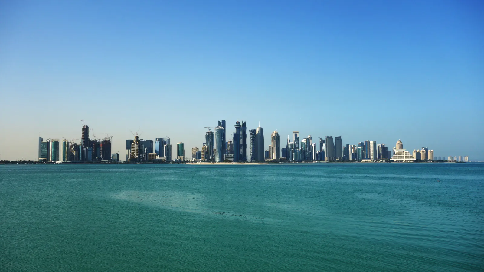 A wide view of Doha’s skyline along the waterfront.