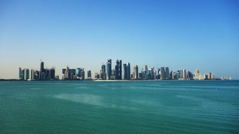 A wide view of Doha’s skyline along the waterfront.