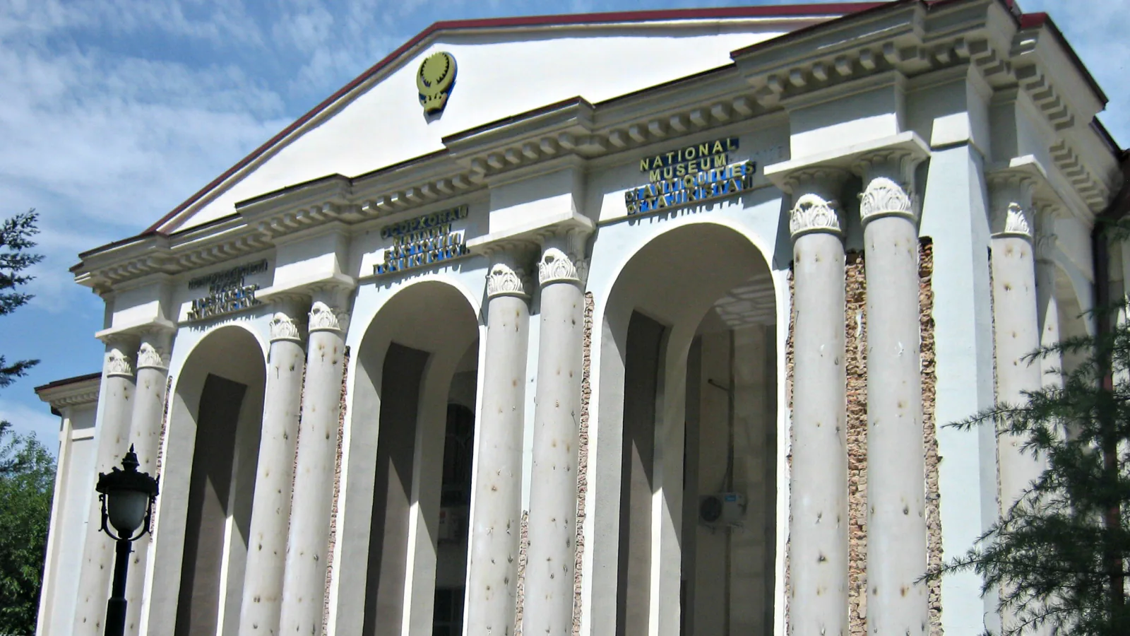 White columned entrance and arches of the National Museum of Antiquities in Dushanbe