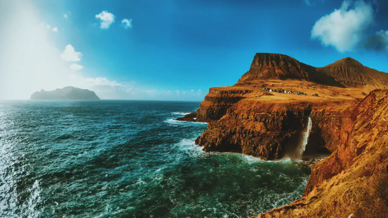 Múlafossur waterfall below Gásadalur’s coastal cliffs on Vágar
