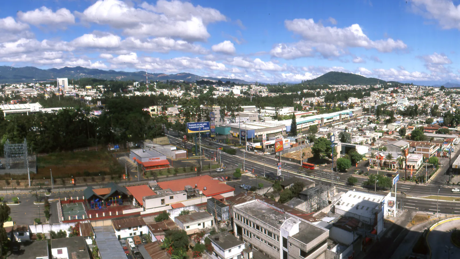 Streets and distant hills of Guatemala City seen from above