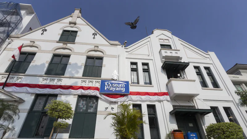 White Wayang Museum facade and blue museum sign in Jakarta
