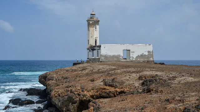 Dona Maria Pia lighthouse and rocky shore at Praia in a 2016 photograph