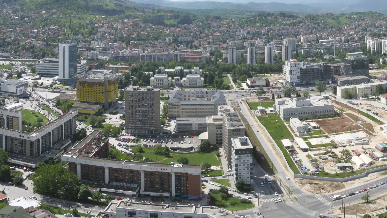 Panorama of Sarajevo’s Marijin Dvor district, surrounding buildings and wooded hills beyond