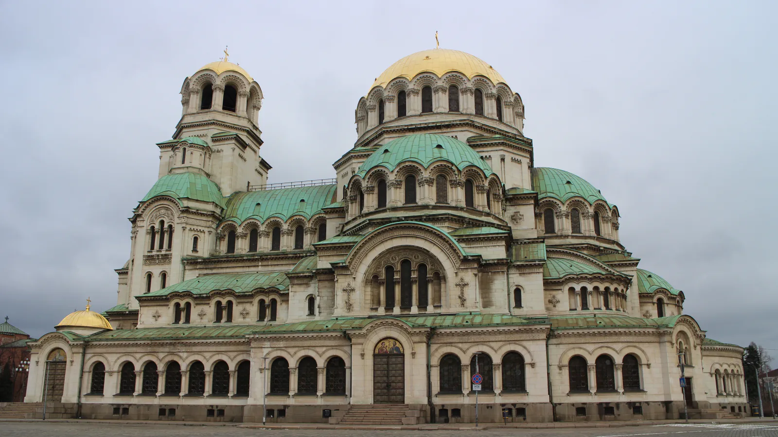 Front facade of Alexander Nevsky Cathedral, with its golden central dome and green roofs